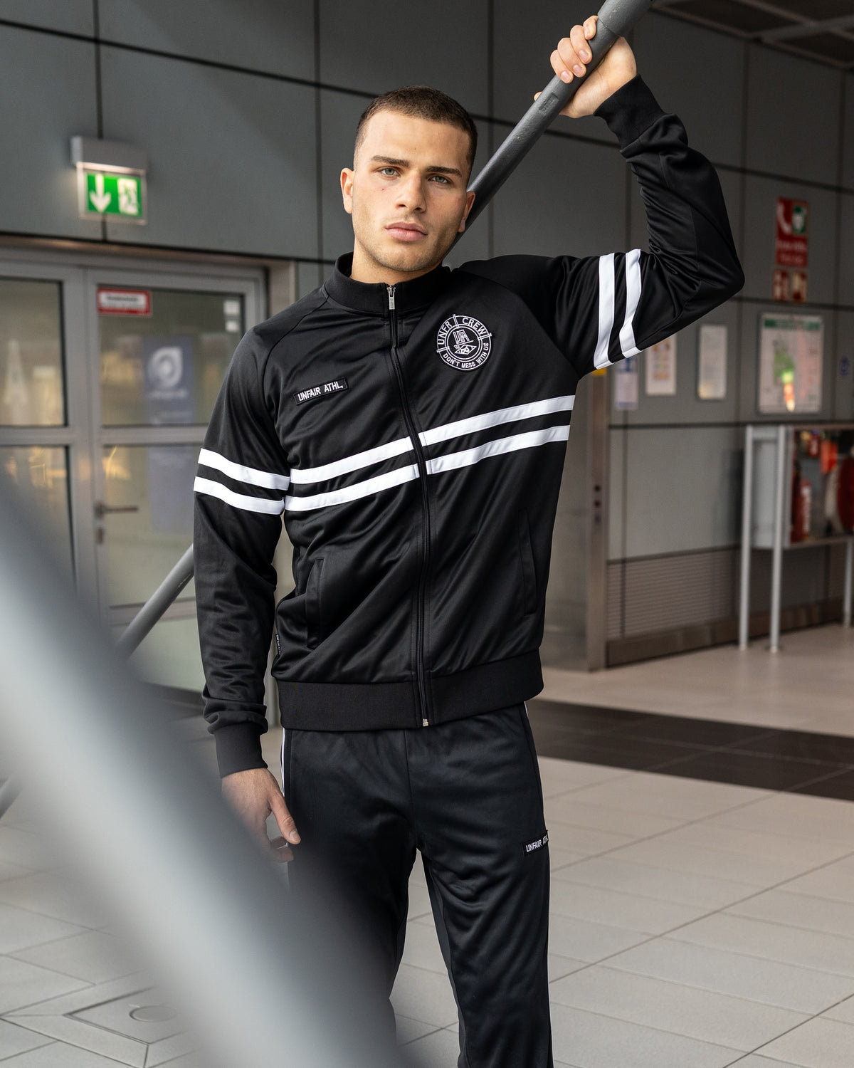 Unfair Athletics DMWU Tracktop | Schwarz